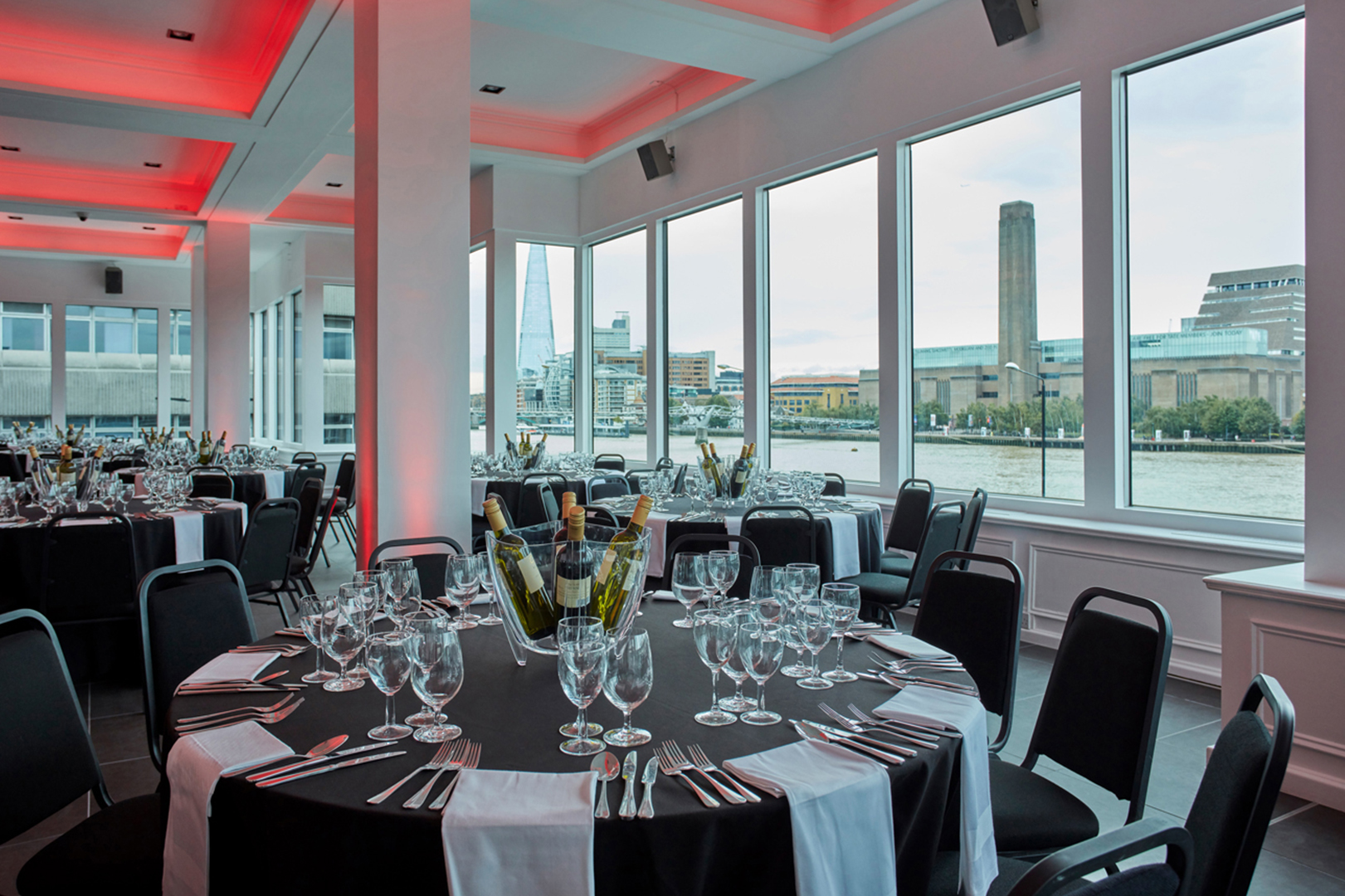 Dine in the River Rooms at The Mermaid. with views of the Tate and the Shard.